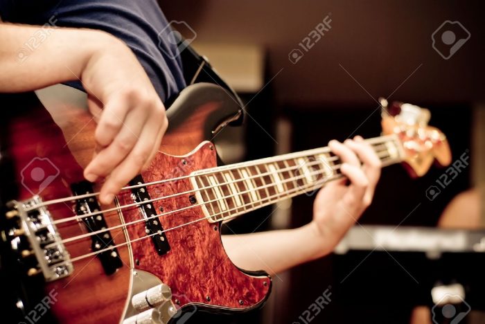 Musitian Plaing on Bass Guitar